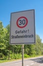 Traffic sign with the inscription danger , road burglary , 30 km/h